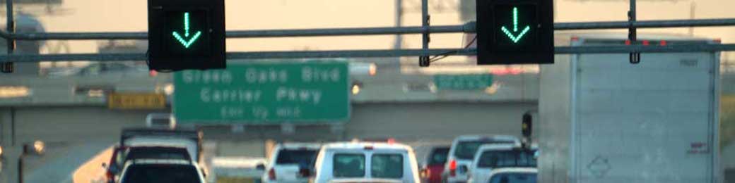 close view of lane arrow signs on freeway