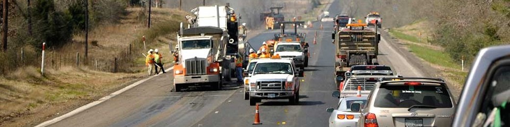 long shot of work zone on highway, with traffic waiting